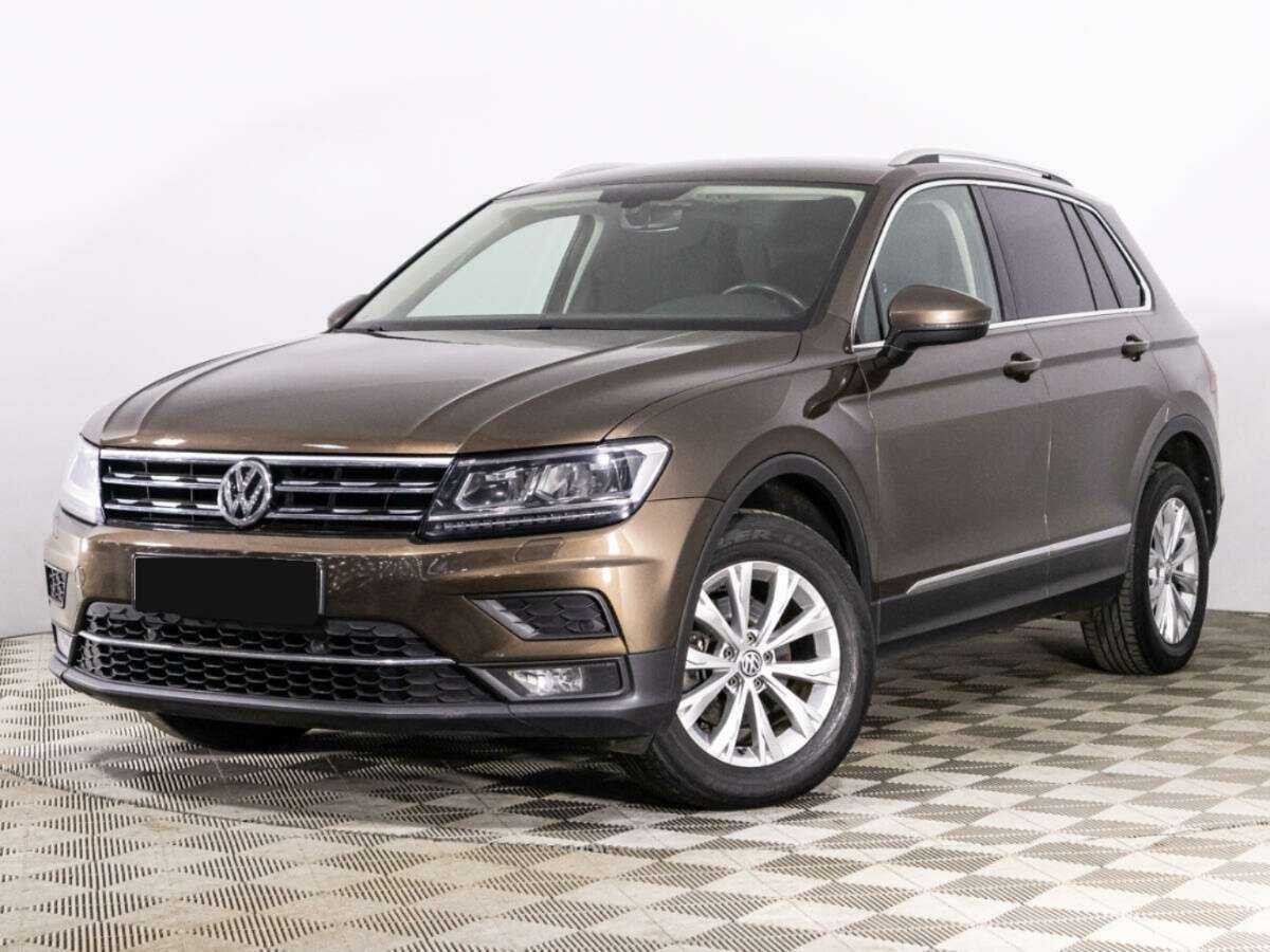 Купить Volkswagen Tiguan с пробегом. Посмотреть фото